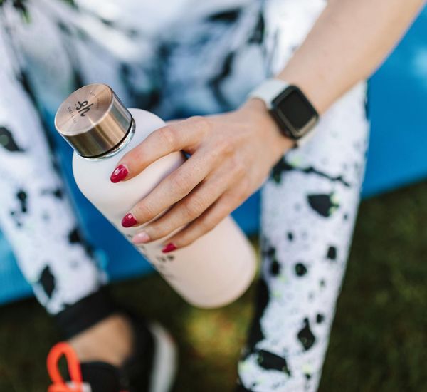 Yoga mat, water bottle, and comfortable sportswear.